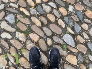 sneakers on cobblestones